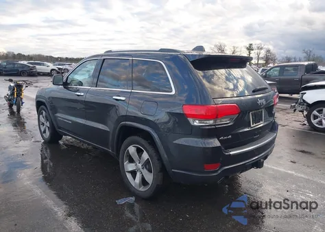 2014 Jeep Grand Cherokee Overland z USA, uszkodzony, nr VIN 1C4RJFCG5EC193882